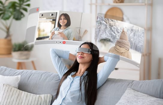 Young woman indulges in VR-enhanced video conversations at home, relaxing on sofa with digital screens