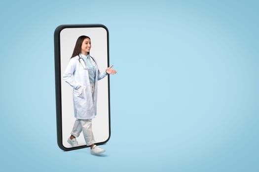 Interactive mobile healthcare with a welcoming doctor, copy space