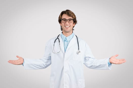 Welcoming male doctor with open arms and smile