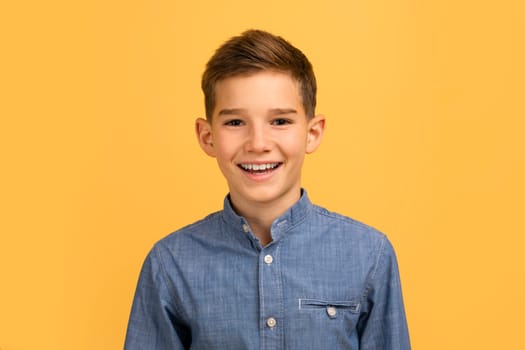Handsome teen boy with happy smile looking at camera