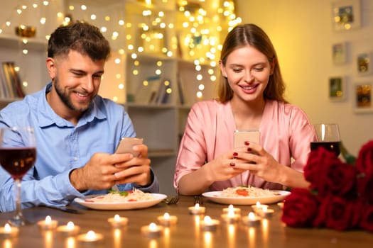 Couple at dinner, distracted by their smartphones