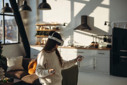 A sunny apartment setting: an energetic young lady in a virtual reality headset.