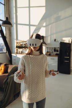 The beautiful young woman in a VR headset is describing her experiences. High quality photo