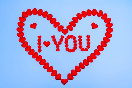 Heart love. Red heart shape from small hearts with the inscription I love you. Valentine's day lovers.