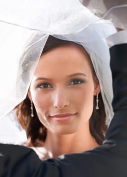 Bride, woman and portrait on wedding day, veil and bridal fashion at ceremony or special event. Female person, face and elegant accessories or luxury jewelry, confident and pride for beauty or makeup