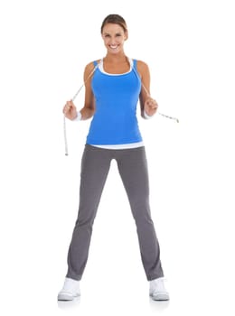 Health, measuring tape and portrait of woman in a studio for exercise, training or workout. Fitness, smile and young happy female person with equipment for weight loss isolated by white background.