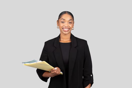 Positive millennial black lady secretary, manager in formal suit