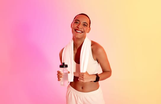 A cheerful woman with a short haircut and a fitness tracker smilingly
