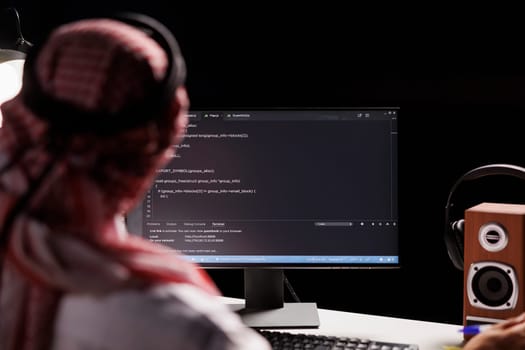 Muslim man using a desktop computer