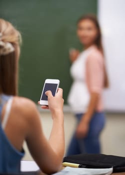Smartphone, student and texting in classroom, social media and communication in school. Female person, behind and internet connection or back, website and mobile application for games and education.