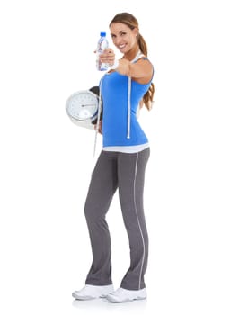 Woman, water bottle and scale for health, nutrition and diet with exercise, workout or results in studio. Portrait of model with measure tape and liquid or offer for training on a white background