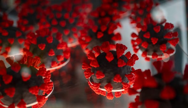 Close-up model of the COVID-19 virus. Meticulously crafted plastic replica of the coronavirus cell bacteria. Showcases the microscopic intricacies of infectious bacteria.