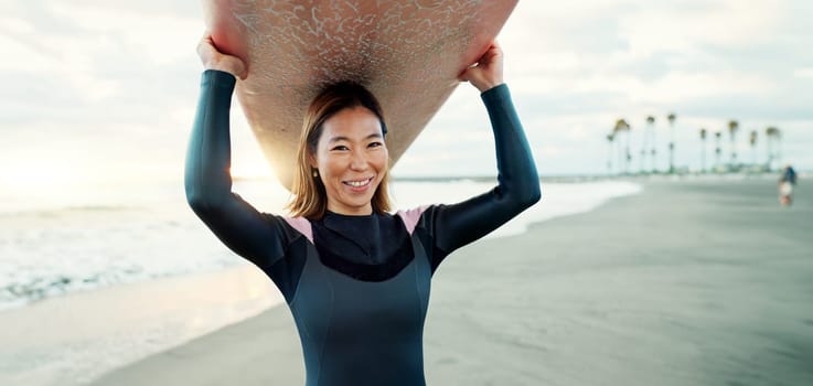 Surfing, beach and portrait of woman with surfboard for water sports, fitness and freedom by tropical ocean. Nature, travel and happy Japanese person on sand on holiday, vacation and adventure by sea