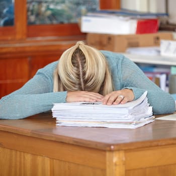 Tired, teacher or sleeping at desk with documents, stress or burnout for paperwork deadline in classroom. School, woman or exhausted professor with fatigue or head down in nap on table for resting