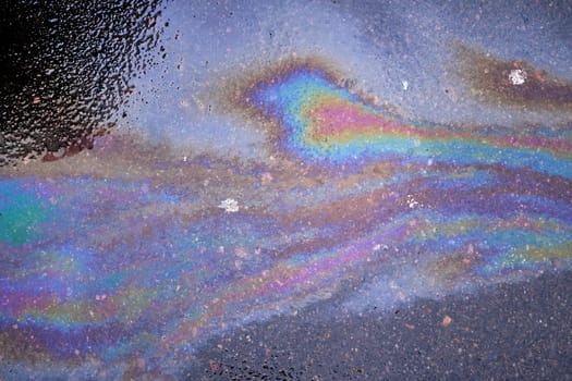 Oil stain or gasoline caused by a leak under a car.