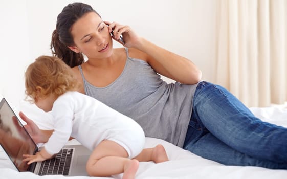 Working, mom and phone call with baby on laptop multitasking in home. Infant, kid and mother busy with computer and smartphone for remote work, productivity and online communication in bedroom