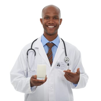 Portrait, black man and happy doctor point at milk for healthy bones, studio nutrition or calcium benefits. Beverage glass, hydration drink or African dietician with dairy product on white background