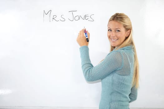 Happy woman, teacher portrait or writing on whiteboard for education, learning or teaching. Smile of a young professor, lecturer or class educator with name in classroom for middle school knowledge