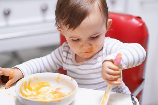 Eating, vitamins and boy baby in chair with vegetable food for child development at home. Organic, nutrition and sweet hungry kid or toddler enjoying healthy lunch, dinner or supper meal at house