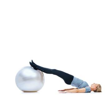 Woman, ball or body balance on space or white background in workout, training or mobility exercise. Female slim athlete, wellness or core fitness for mockup, stretching legs or flexibility in studio