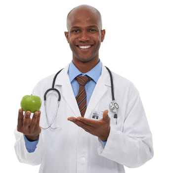 Portrait, doctor and happy black man with apple for fruit diet, healthcare nutrition or vitamin c benefits. Studio, vegan food and African nurse smile for health recommendation on white background