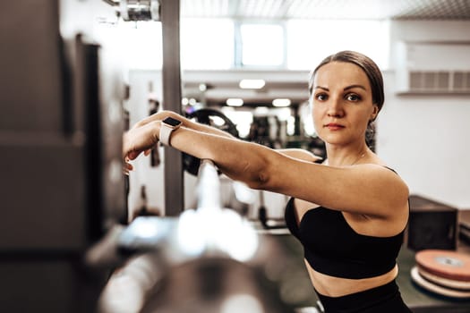 Portrait of a female personal trainer in a gym