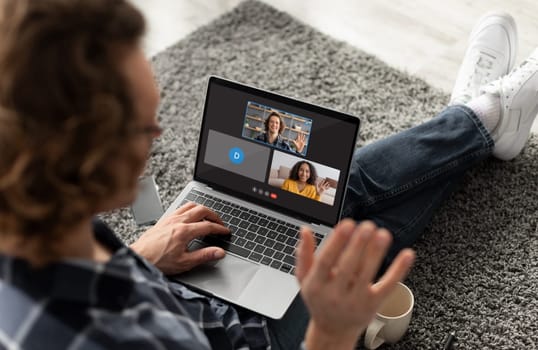 Cool guy enjoying video chat with friends