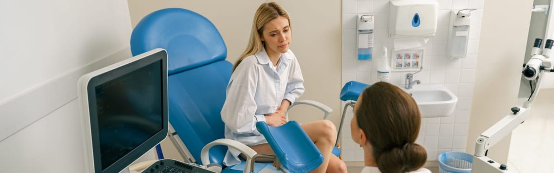Sad woman on appointment with her gynecologist during regular visit to women's consultation