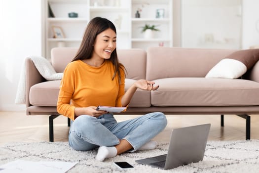 Young asian woman entrepreneur working from home