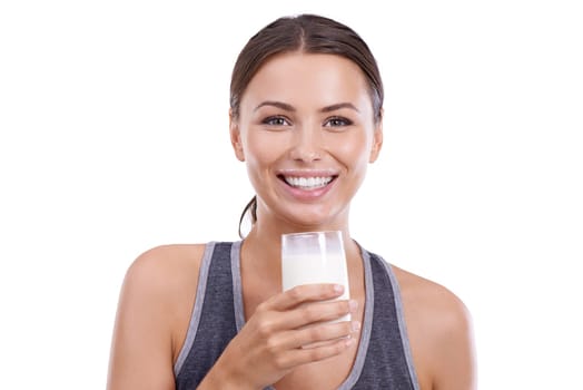 Woman, portrait and glass of milk in studio for wellness, calcium and bone health with happiness or mockup space. Athlete, person or face with smile for nutrition or dairy product on white background