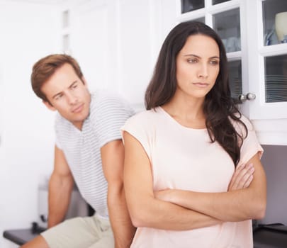 Angry, woman and man fight with conflict or drama in life, mistake or marriage fail, anxiety and stress at home. Frustrated couple argue in kitchen, cheating problem or crisis with risk of divorce
