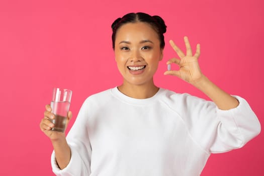 Healthy Diet Nutrition. Asian Woman Holding Vitamin Pill And Glass Of Water
