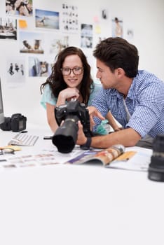 Camera, editor and team of photographers with photoshoot in studio in a office or workshop for production. Creative, photography and artists with dslr equipment for picture inspection in workplace.
