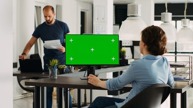 Specialist looks at greenscreen template