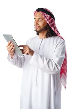 Arab man using digital tablet wearing traditional clothes isolated on white