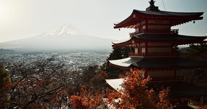 Japanese temple, pagoda building with mountain and architecture, religion and tradition for travel and environment. Traditional real estate, faith with culture and landmark, nature and Buddhism.