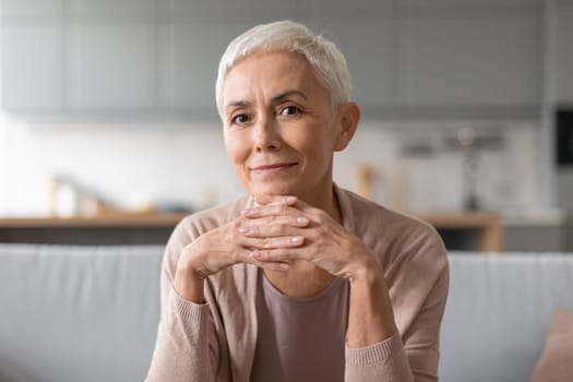 Portrait of confident european senior lady with stylish haircut indoor