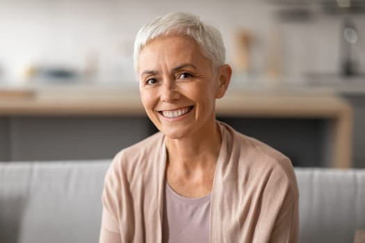 Portrait Of Smiling Senior Lady With Gray Short Hair Indoors