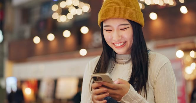 Phone, search and Japanese woman in city for travel, chat or map navigation outdoor. Smartphone, smile or happy lady person in Japan with app for location, guide or taxi, service or chauffeur request