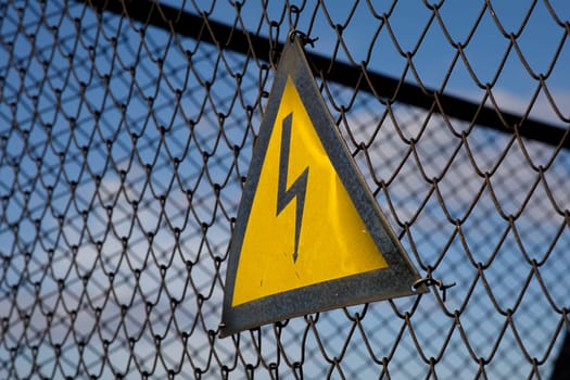 electrical hazard sign on the grid