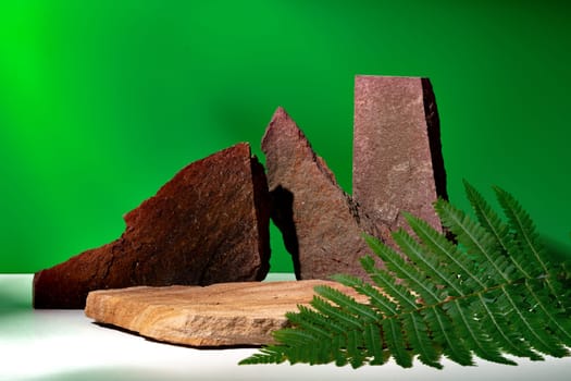 Stone display for product against green background