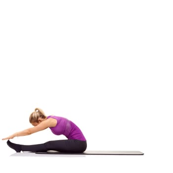 Woman, stretching or fitness on mat in studio for exercise, workout or healthy body with mock up space. Person, training or wellness for abdomen muscle or core strength and yoga with white background