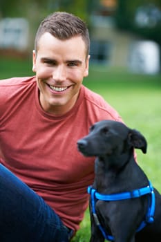 Man, dog and portrait at outdoor love for bonding connection, pet training for obedience. Male person, animal and face at rescue shelter garden for happy home care, environment walk on grass field