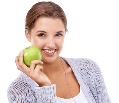 Woman, portrait and apple, nutrition and gut health with snack, happy with diet for weight loss on white background. Healthy food, wellness and green fruit, vegan and organic with smile in studio