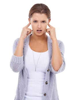Noise, portrait or woman with fingers in ears in studio for volume control, sensitive or block on white background. Annoyed, stop or model with not listening gesture, sound or frustrated by tinnitus