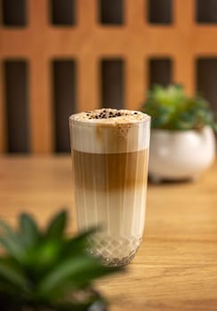 Glass with delicious hot latte macchiato