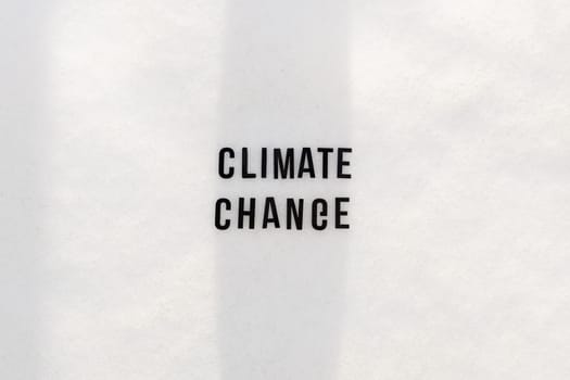 Text climate change on snowy background.