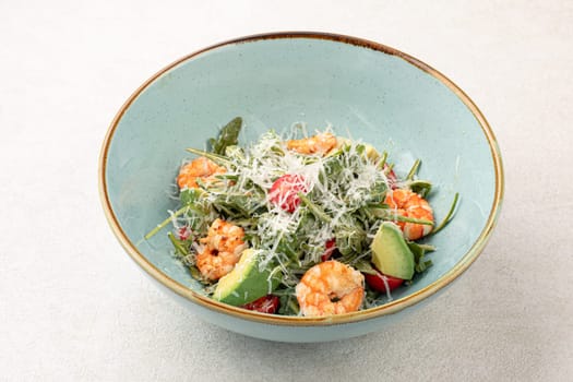 Portion of caesar salad with shrimp