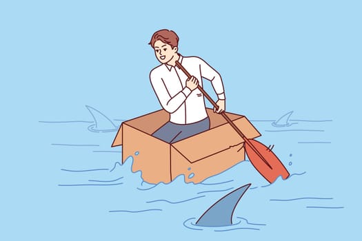 Brave business man shows no fear, overcoming crisis and floating in box in river with sharks