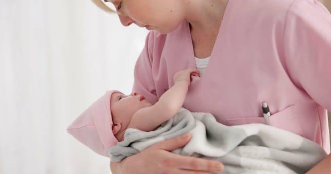 Nurse, woman and newborn in hospital for wellness, medical checkup or examination with support or care. Pediatrician, professional and holding baby in clinic with bond and relax for child development